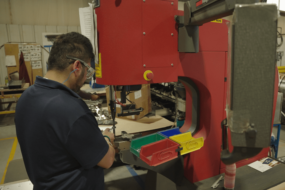 Employee working on value added assembly